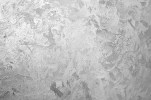 Gray wall with decorative Venetian plaster, frontal view. Background photo texture
